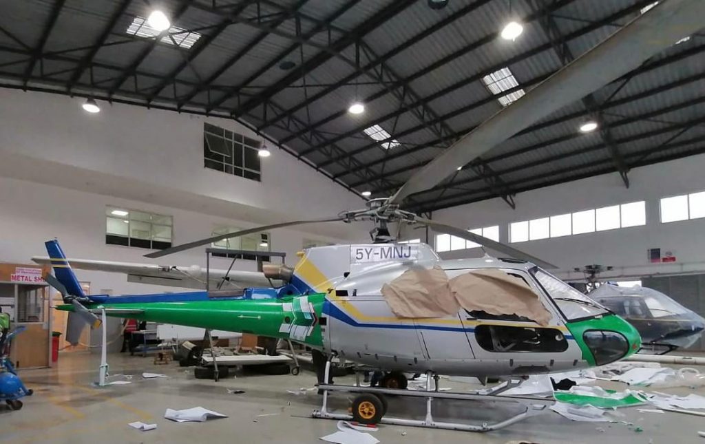 AS350 type of helicopter, registration 5Y-MNJ being branded for the World Rally Championships